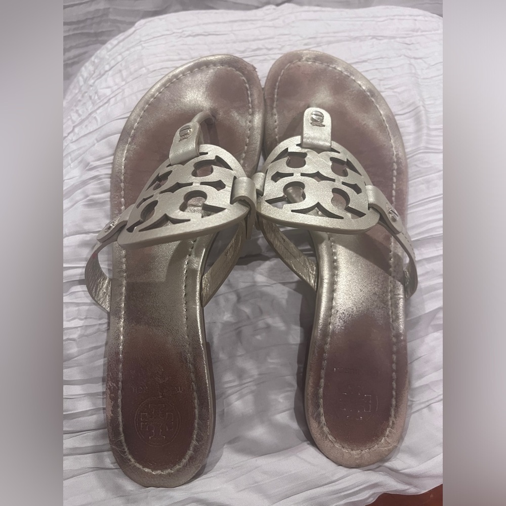 Tory Burch soft gold colored Miller sandals.